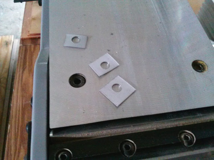 I drilled 3/8 in holes, then cut the sheet metal in to squares. 